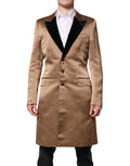 Manteau trench en soie marron à simple boutonnage de Dolce & Gabbana, aperçu de face avec ceinture à la taille.