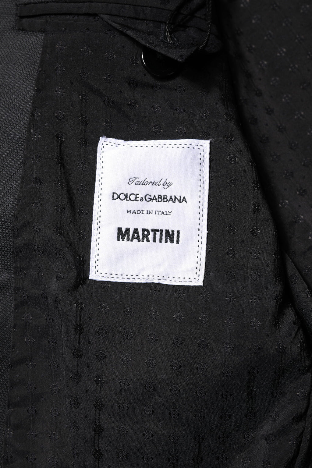 Costume homme Dolce & Gabbana Martini gris foncé à deux pièces, veste croisée simple, pantalon assorti.