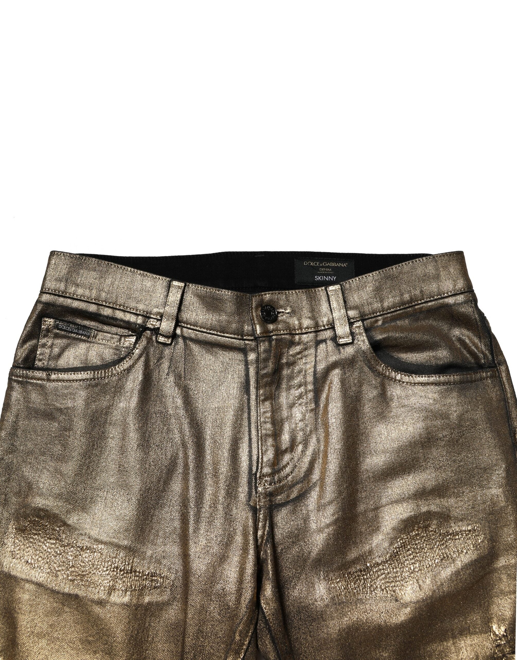 Jeans slim en denim tacheté en coton stretch doré de Dolce & Gabbana, style décontracté avec déchirures.