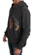 Pull Dolce & Gabbana gris à capuche avec cœur en cristal rouge et motif pistolet, sweat-shirt tendance pour femme.