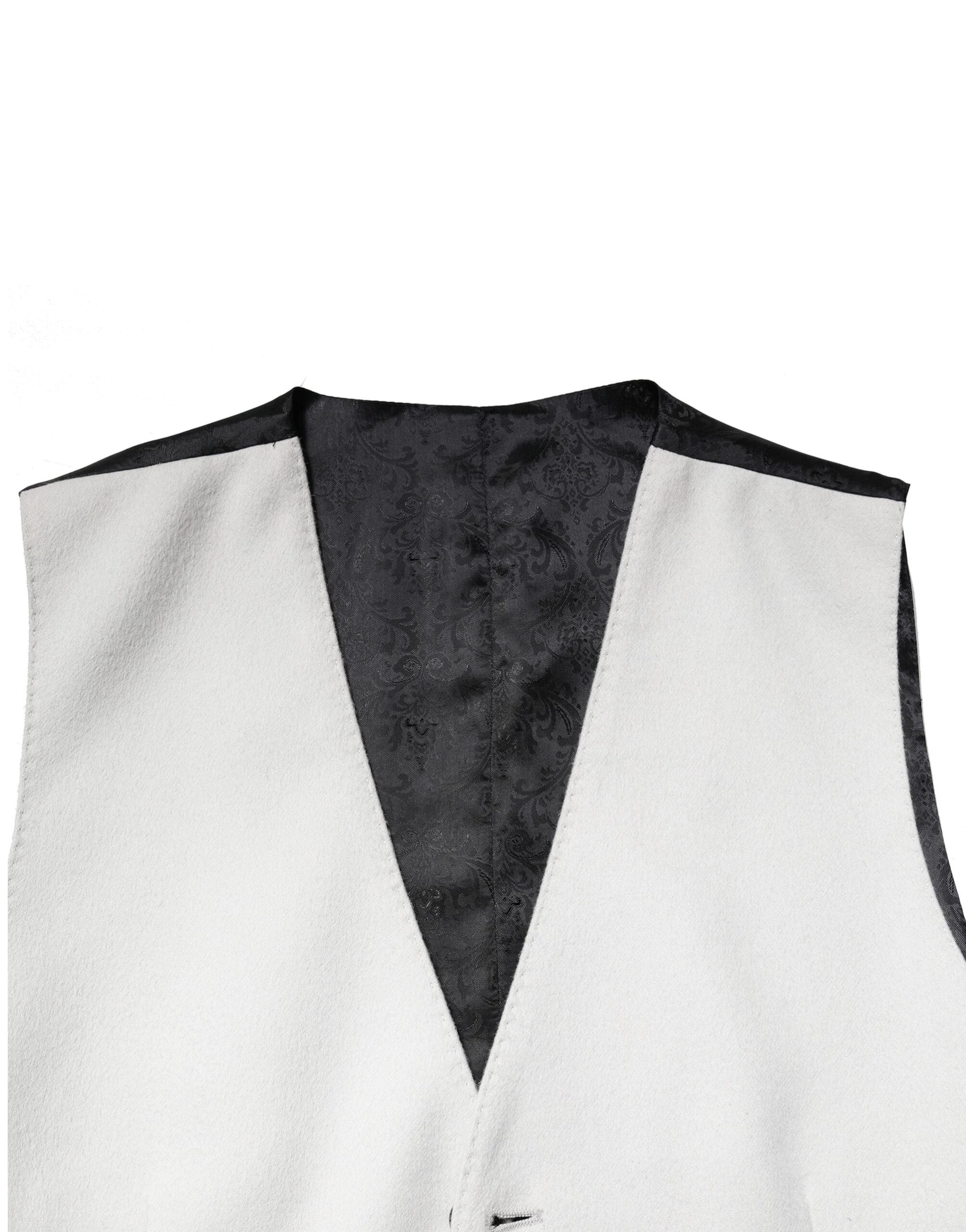 Gilet homme en laine gris de marque Dolce & Gabbana, vêtement formel avec coupe élégante et détails sophistiqués.