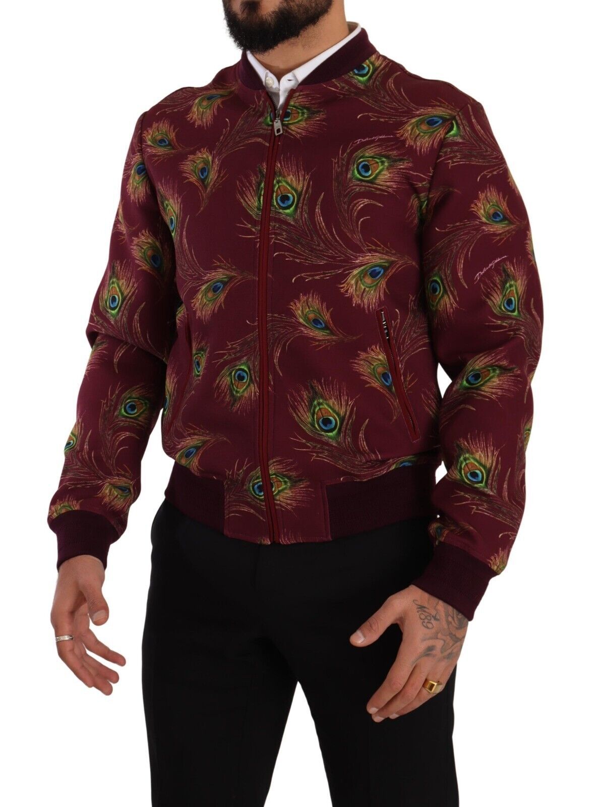 Veste zippée en polyester stretch rouge avec motif paon, de la marque Dolce & Gabbana, détails élégants et design sophistiqué.