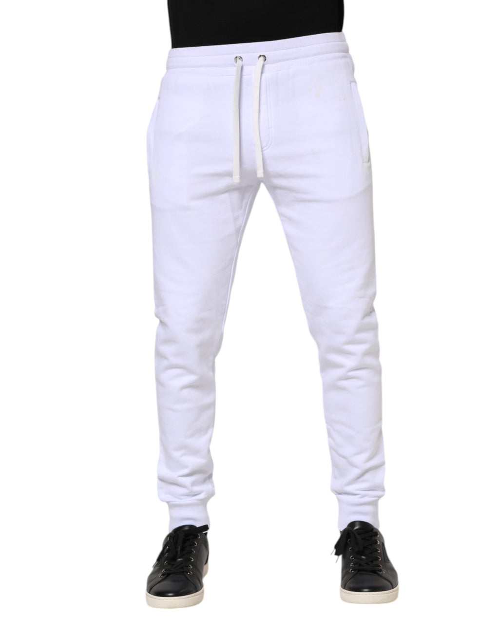 Pantalons jogger en coton blanc Dolce & Gabbana avec cordons de serrage, détendus et confortables, vue de face.