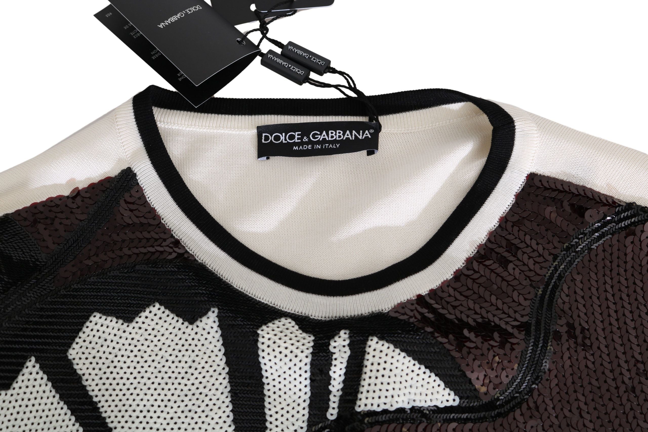 Pull en coton blanc Dolce & Gabbana avec sequins en forme de guitare et motif jazz, style élégant et tendance.
