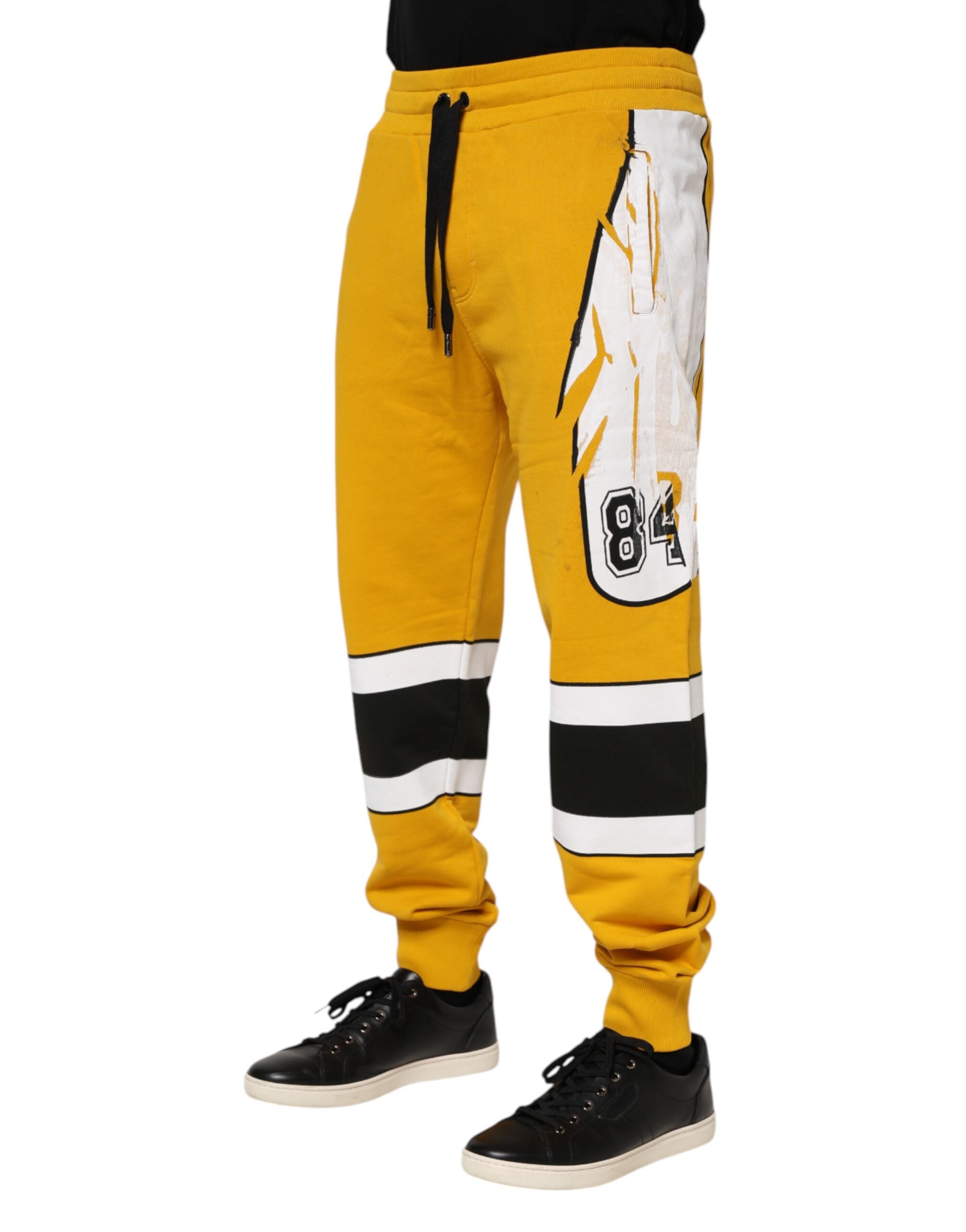 Pantalons jogger en coton jaune imprimé de Dolce & Gabbana, sweatpants décontractés avec motif coloré.