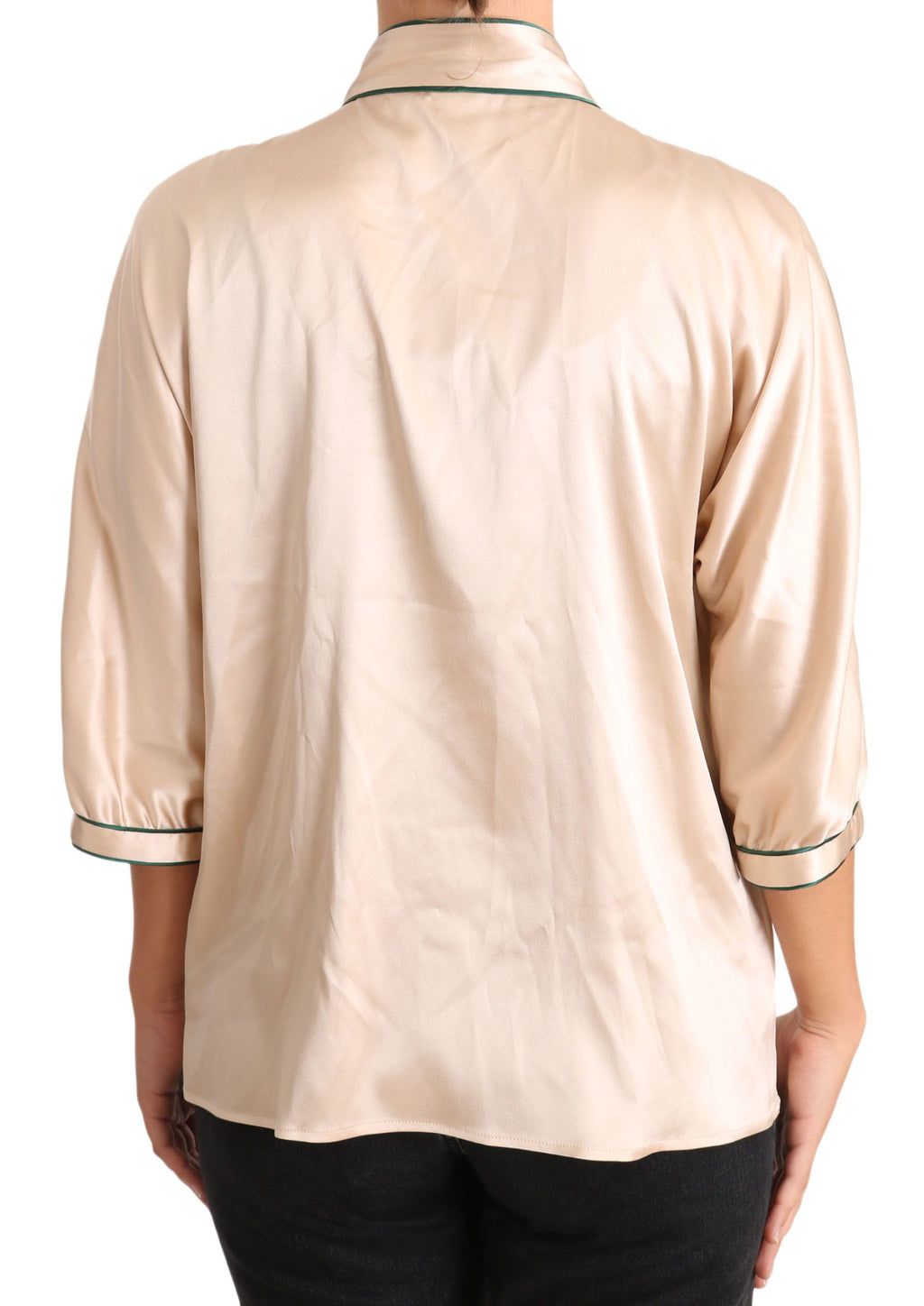 Blouse en soie stretch beige avec ruban Dolce & Gabbana, haut élégant et féminin, détail de ruban sur le col ou l’encolure.