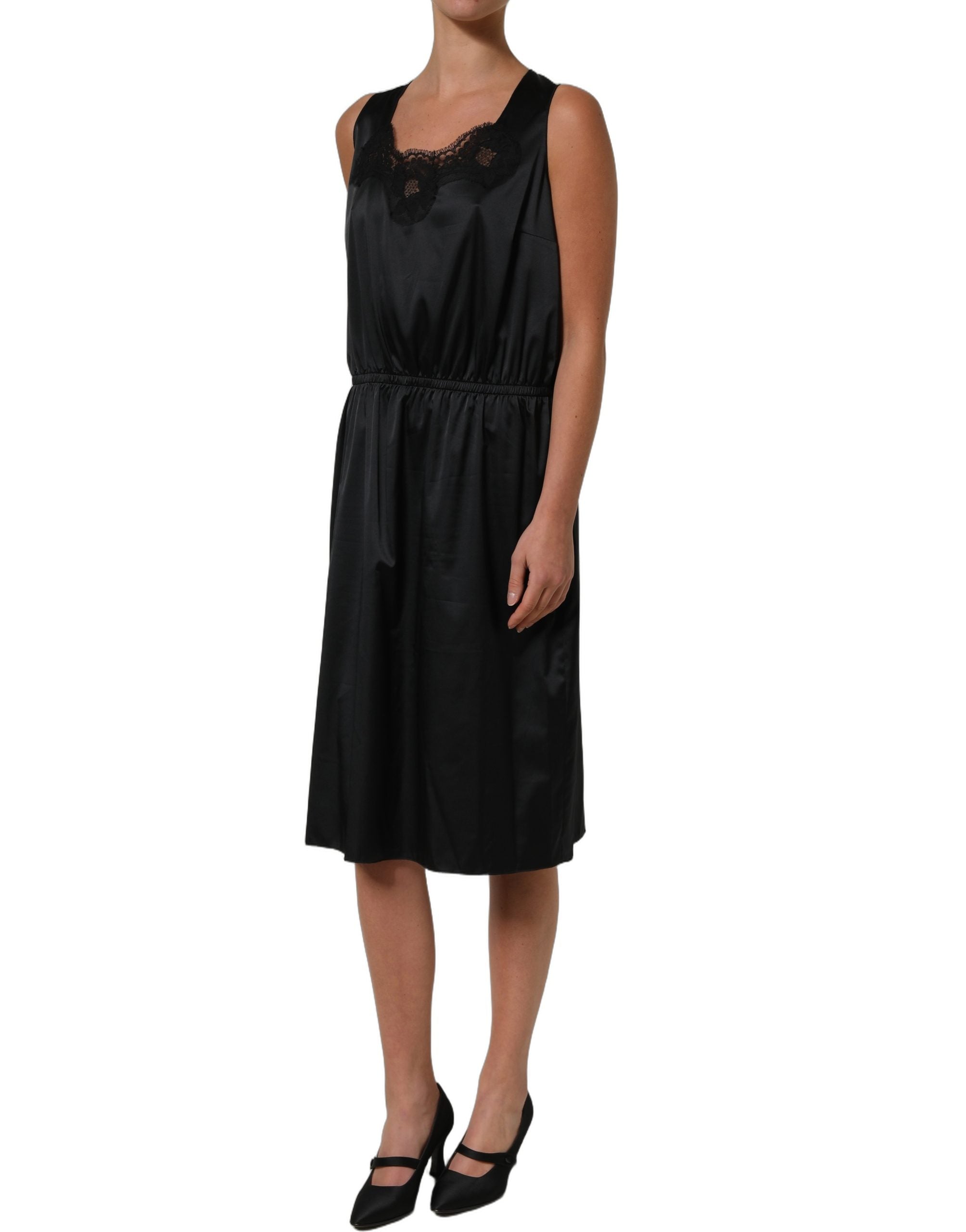 Robe midi noire en polyester avec dentelle Dolce & Gabbana, coupe ajustée élégante et détails raffinés.