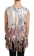Débardeur Dolce & Gabbana avec sequins dorés et franges roses, sans manches, porté sur un mannequin blanc.