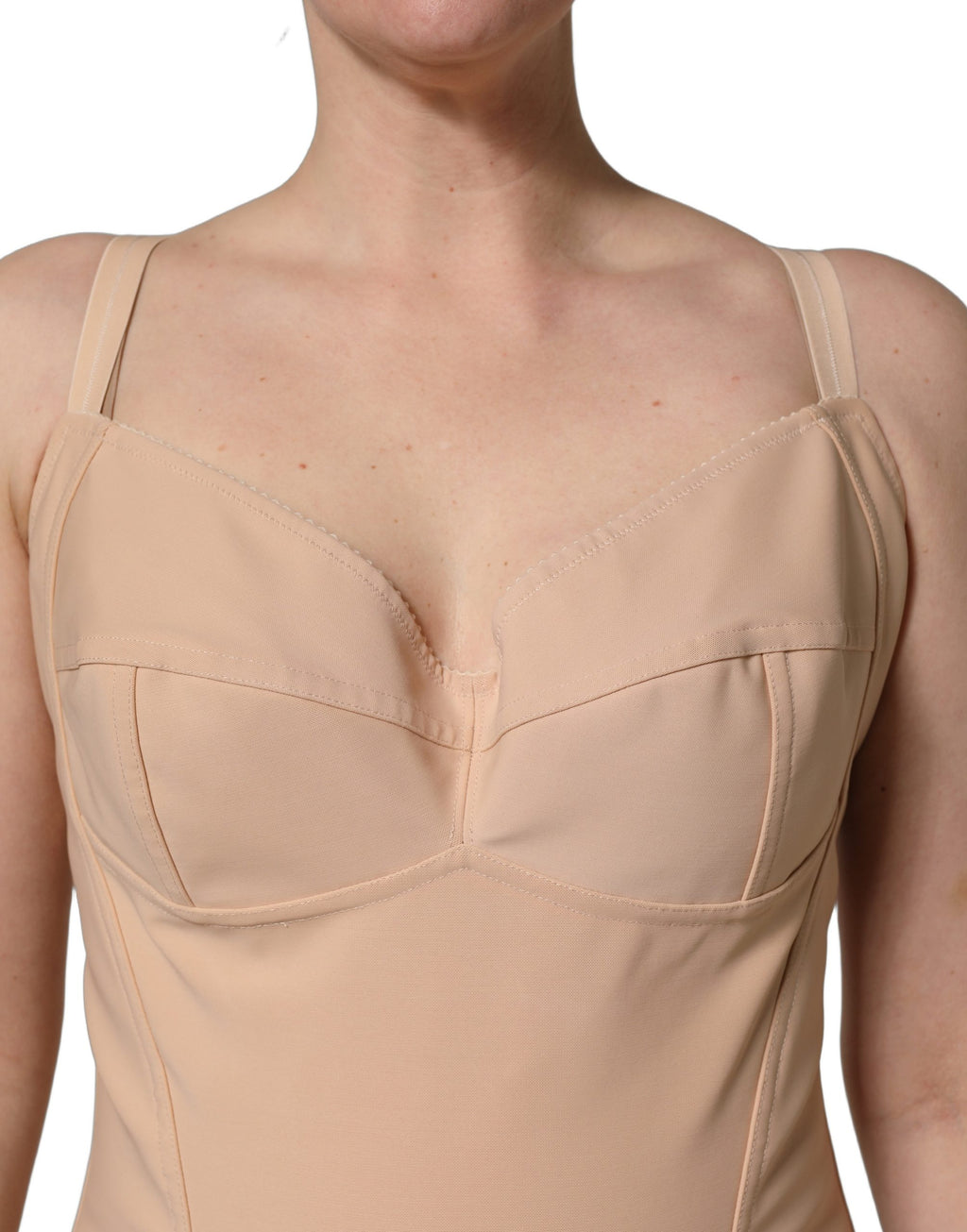 Combinaison bodysuit en nylon nude de Dolce & Gabbana, corps entier, ajustée et élégante, visible en détail dans l'image.