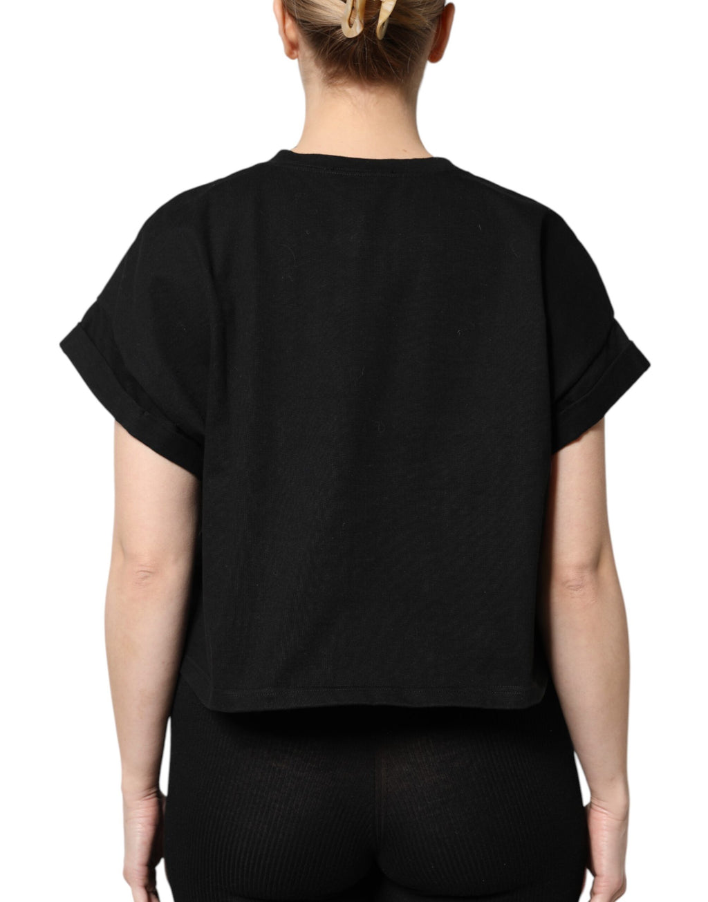 T-shirt noir en coton imprimé à manches courtes de la marque Dolce & Gabbana visible sur l'image.