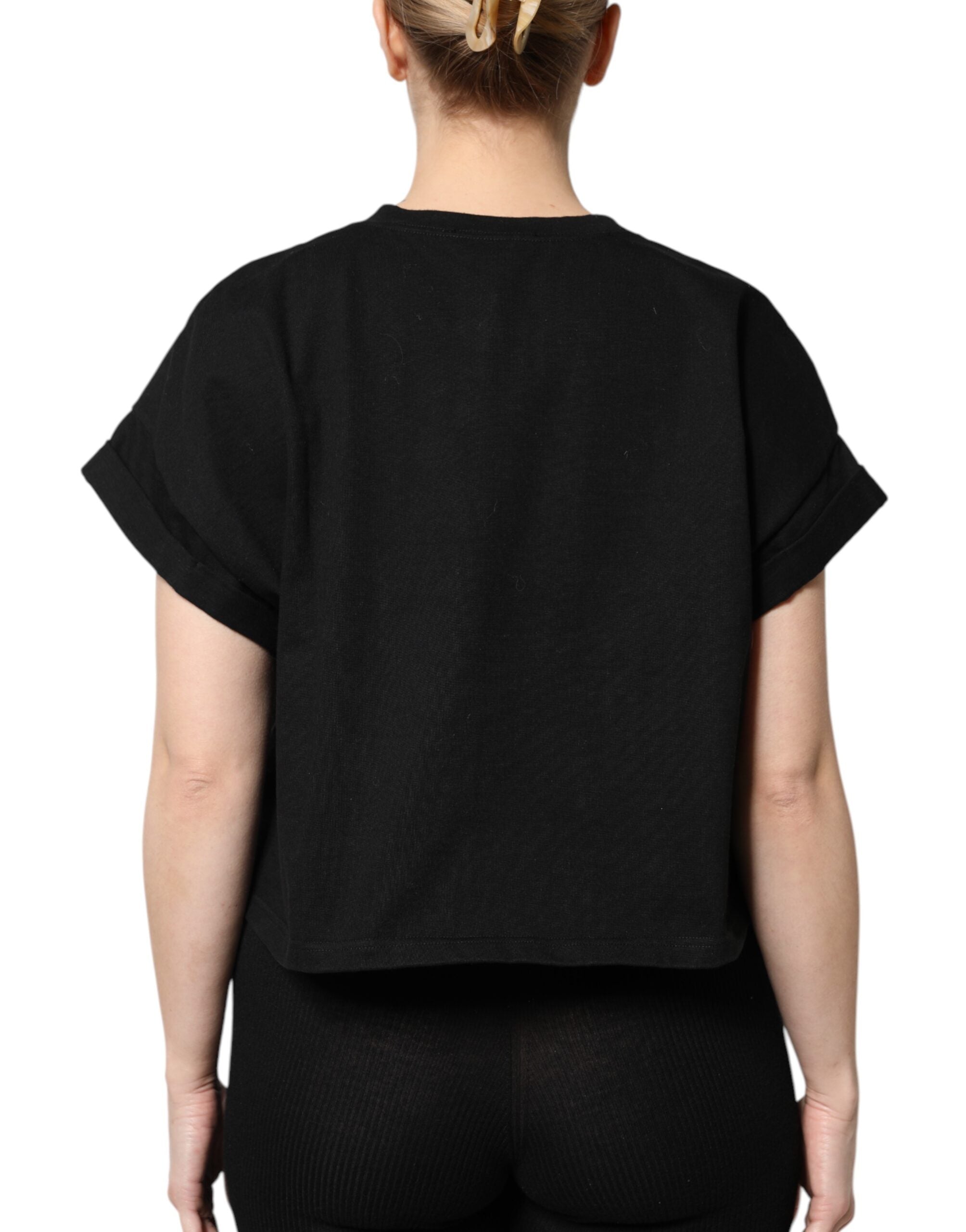T-shirt noir en coton imprimé à manches courtes de la marque Dolce & Gabbana visible sur l'image.