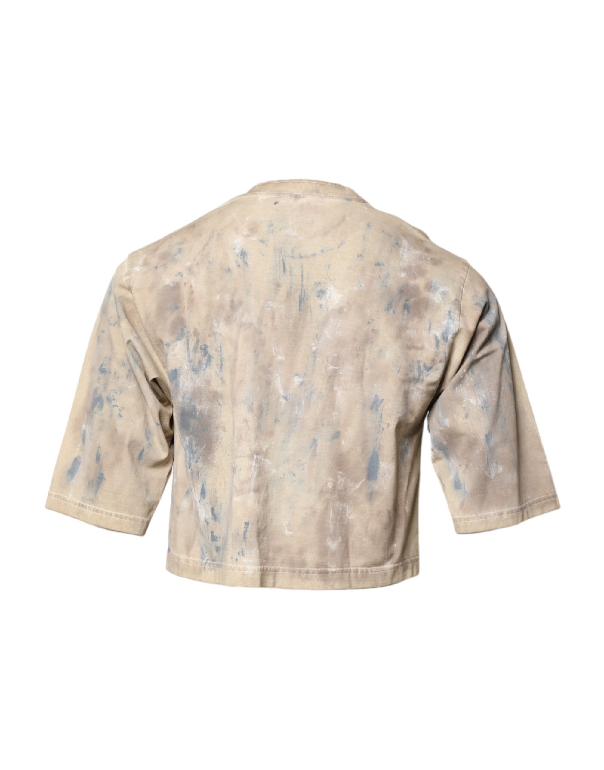 T-shirt courte beige Dolce & Gabbana avec broderie DG et effet tie-dye, mode tendance et détails creatifs visibles.