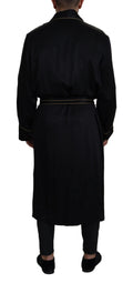 Robe manteau en soie noire Dolce & Gabbana, veste élégante en satin avec ceinture à la taille, vue de face.