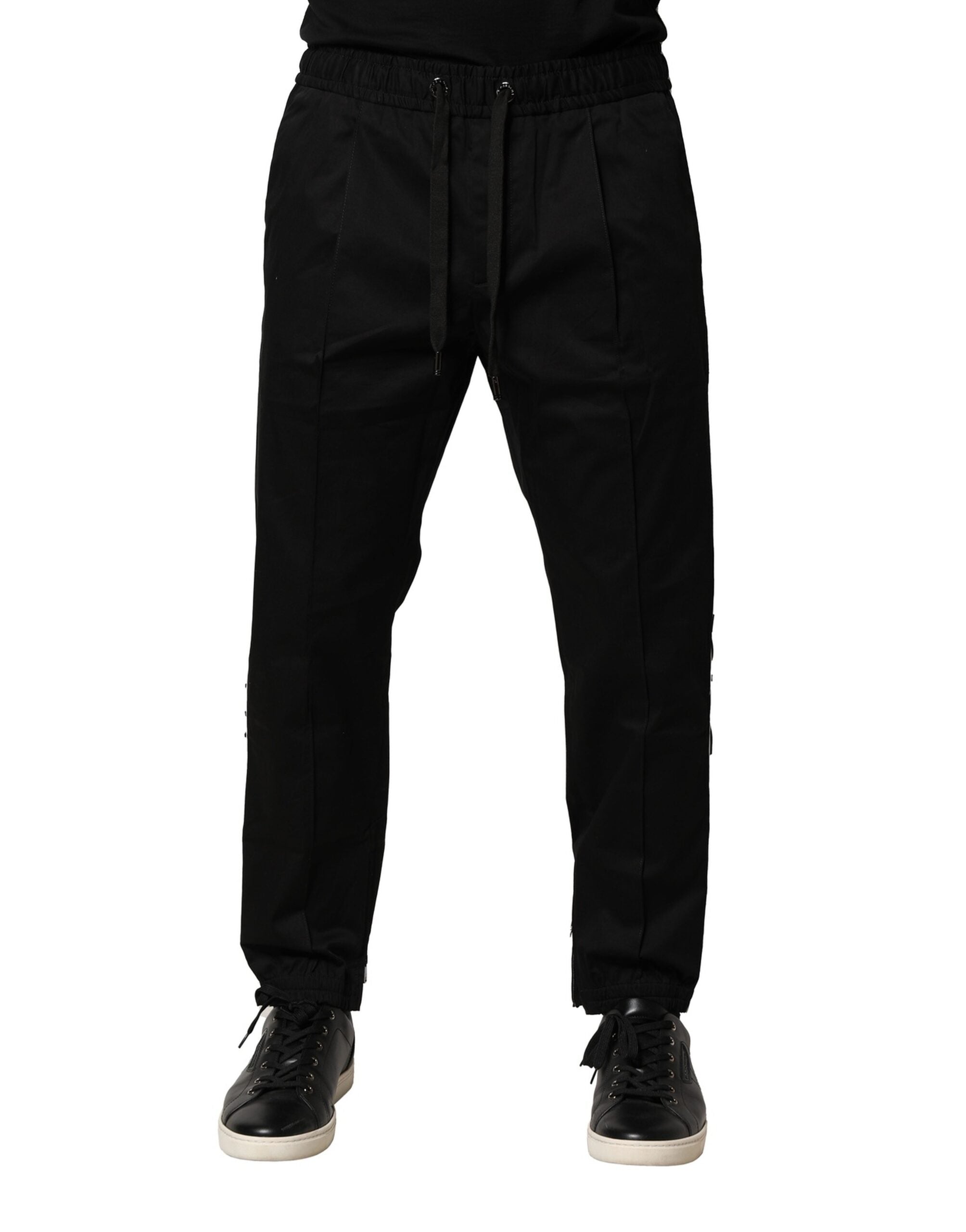 Pantalons jogger noirs en coton Dolce & Gabbana, taille mi-haute, avec détails de couture visibles sur le tissu.