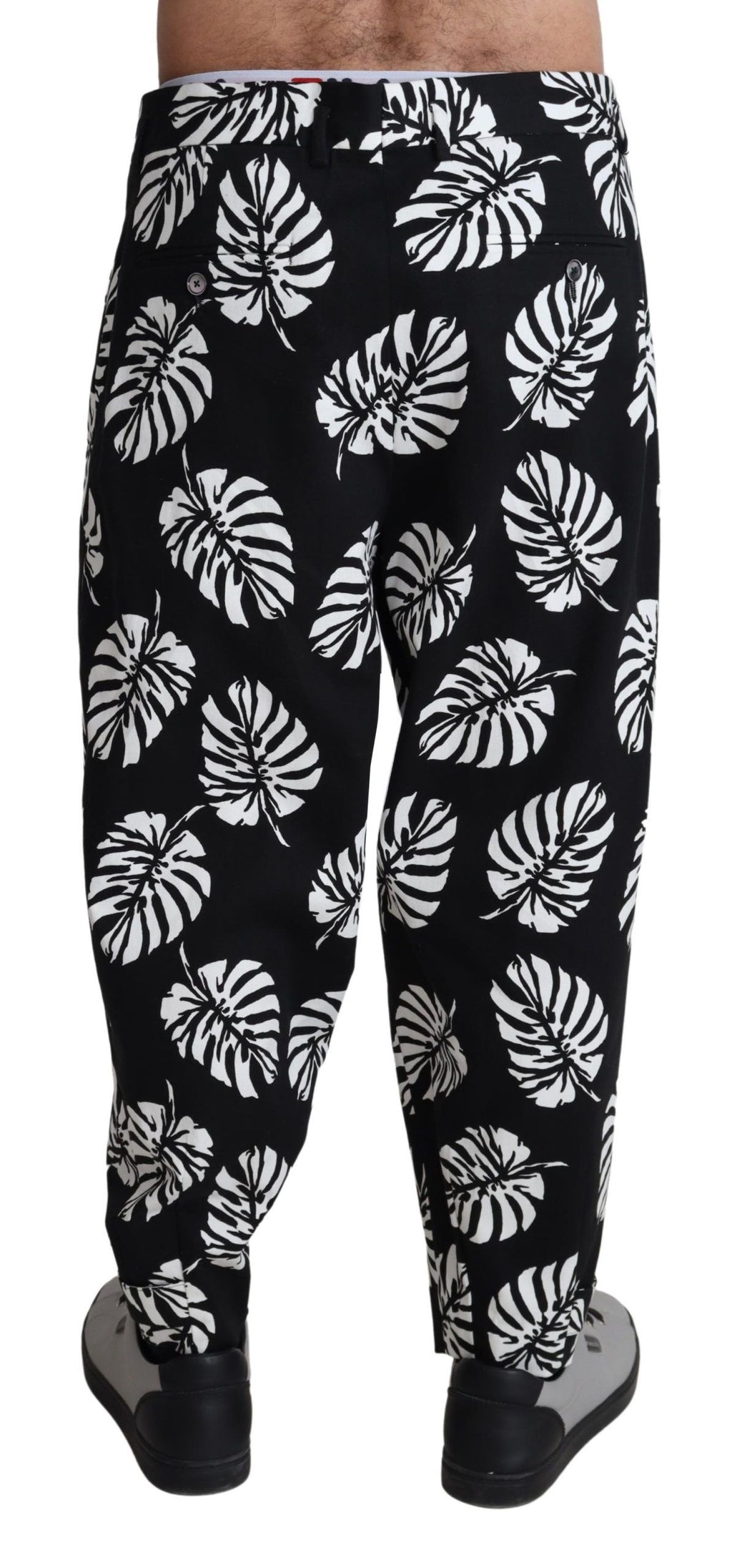 Pantalon noir en coton extensible avec motif de feuilles Dolce & Gabbana, style élégant et moderne.