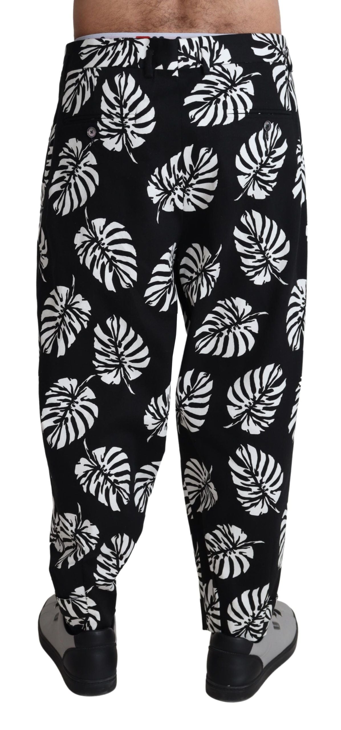 Pantalon noir en coton extensible avec motif de feuilles Dolce & Gabbana, style élégant et moderne.