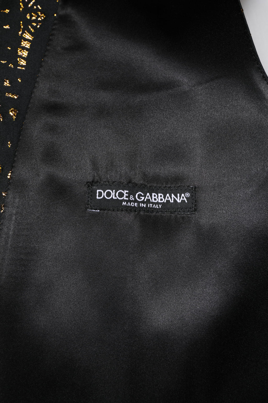 Gilet homme noir en lurex de la marque Dolce & Gabbana, costume formel élégant avec finition brillante.