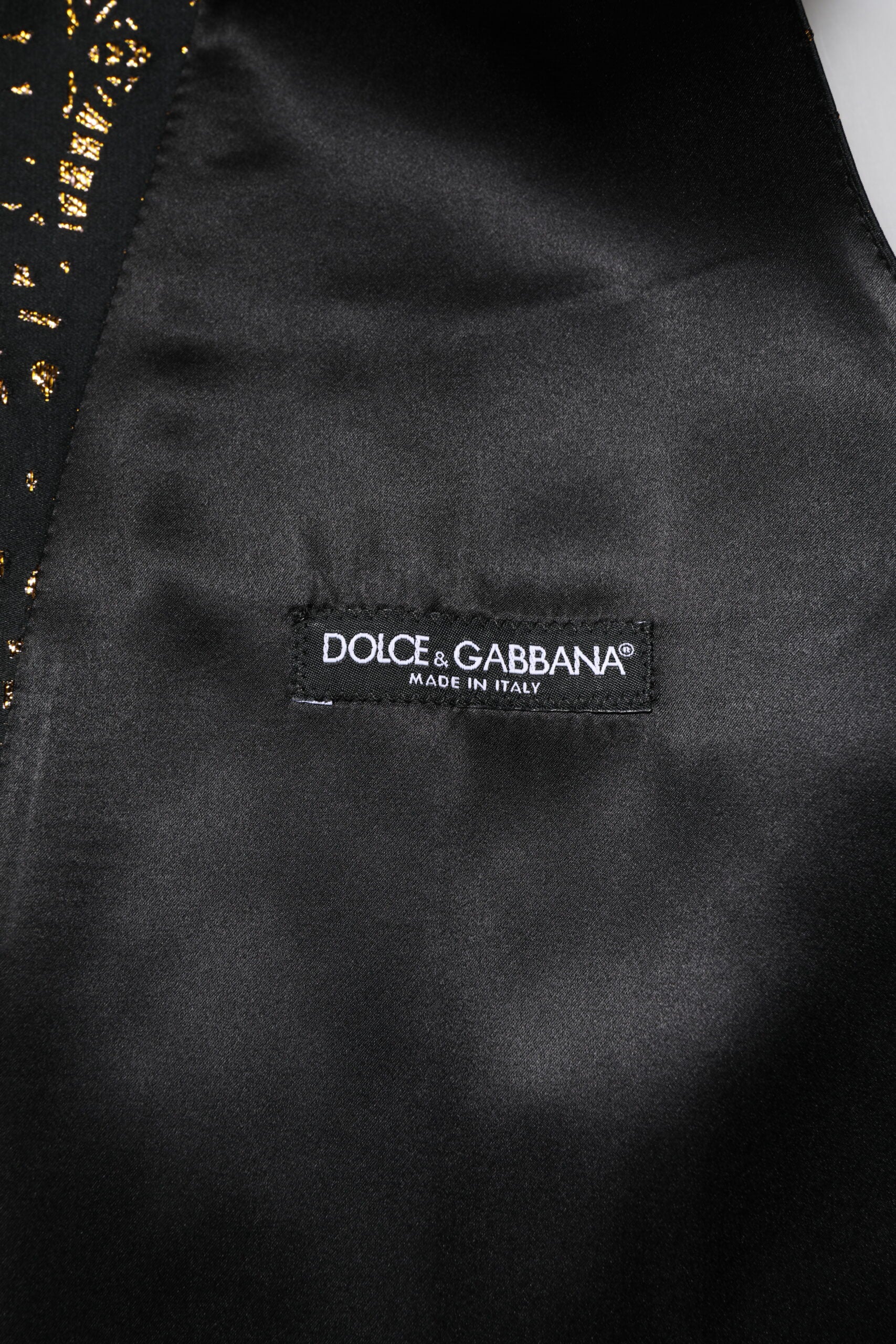Gilet homme noir en lurex de la marque Dolce & Gabbana, costume formel élégant avec finition brillante.