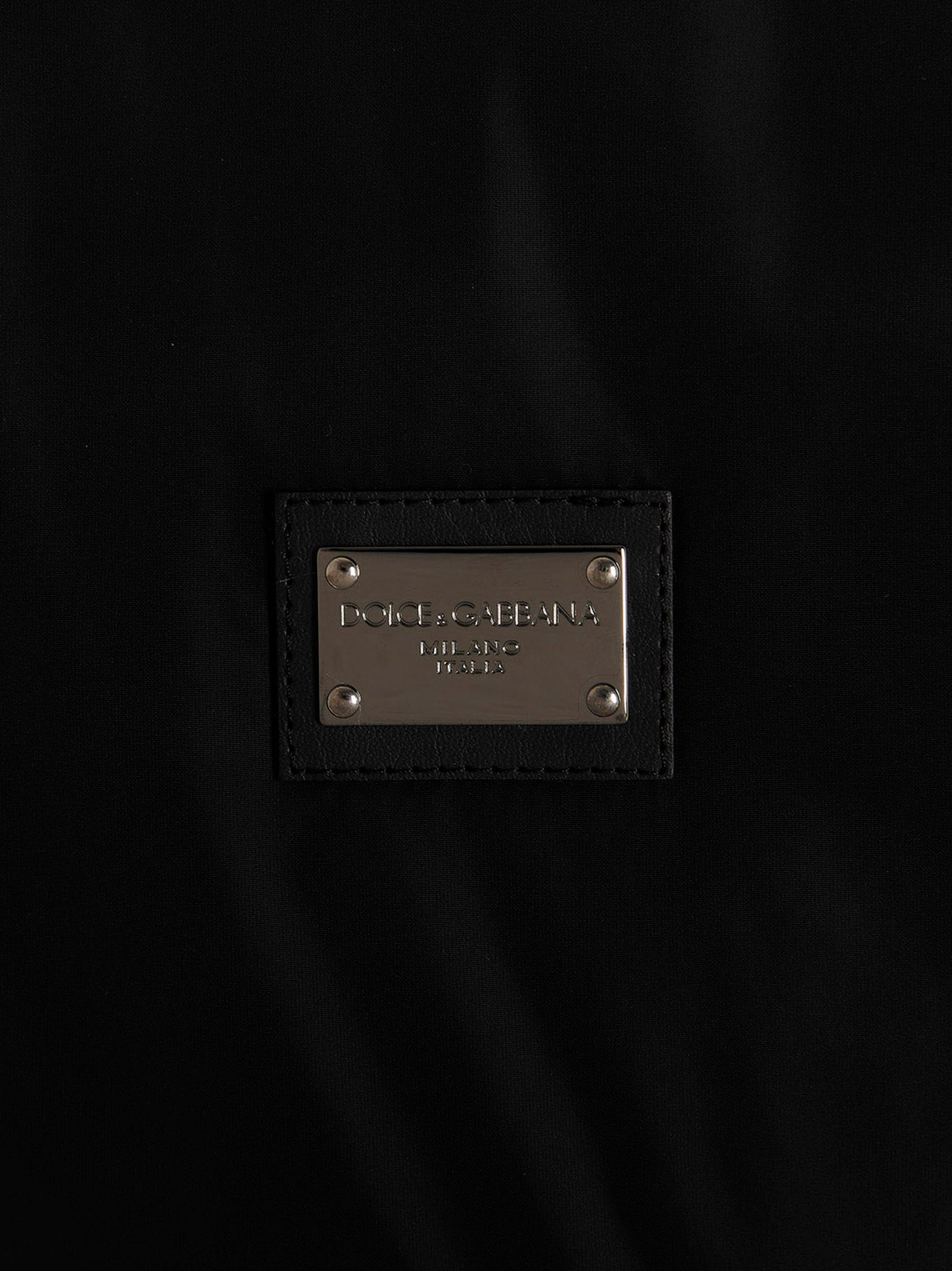 Veste bomber noire en polyamide de Dolce & Gabbana, style élégant et moderne, visible en détail dans l'image.