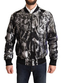 Veste bomber noire et argent Dolce & Gabbana avec motif Puppi, détails stylés et design élégant visible sur l'image.