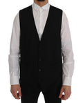 Gilet noir en laine stretch Dolce & Gabbana STAFF avec col en V et fermeture à boutons, porté sur un mannequin.
