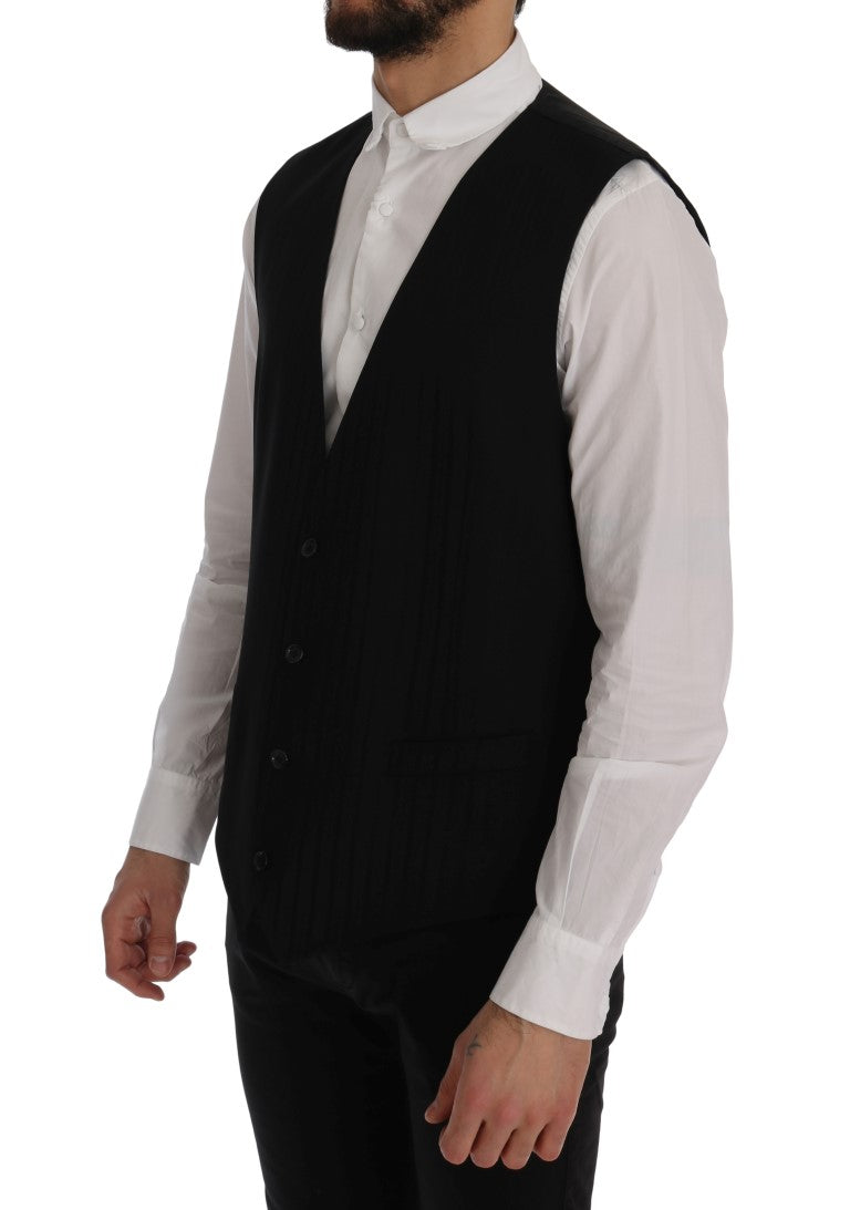 Gilet noir en laine et stretch Dolce & Gabbana Staff, coupe ajustée avec détails élégants, porté sur un mannequin.
