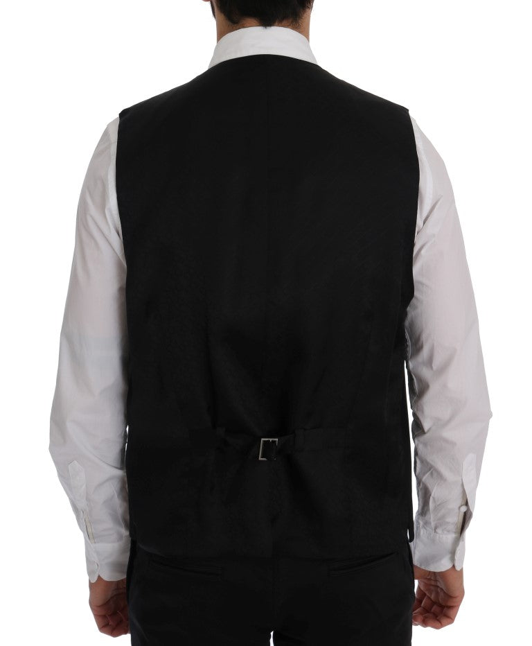 Gilet noir en laine extensible Dolce & Gabbana STAFF, coupe ajustée et détails élégants, porté sur un mannequin.
