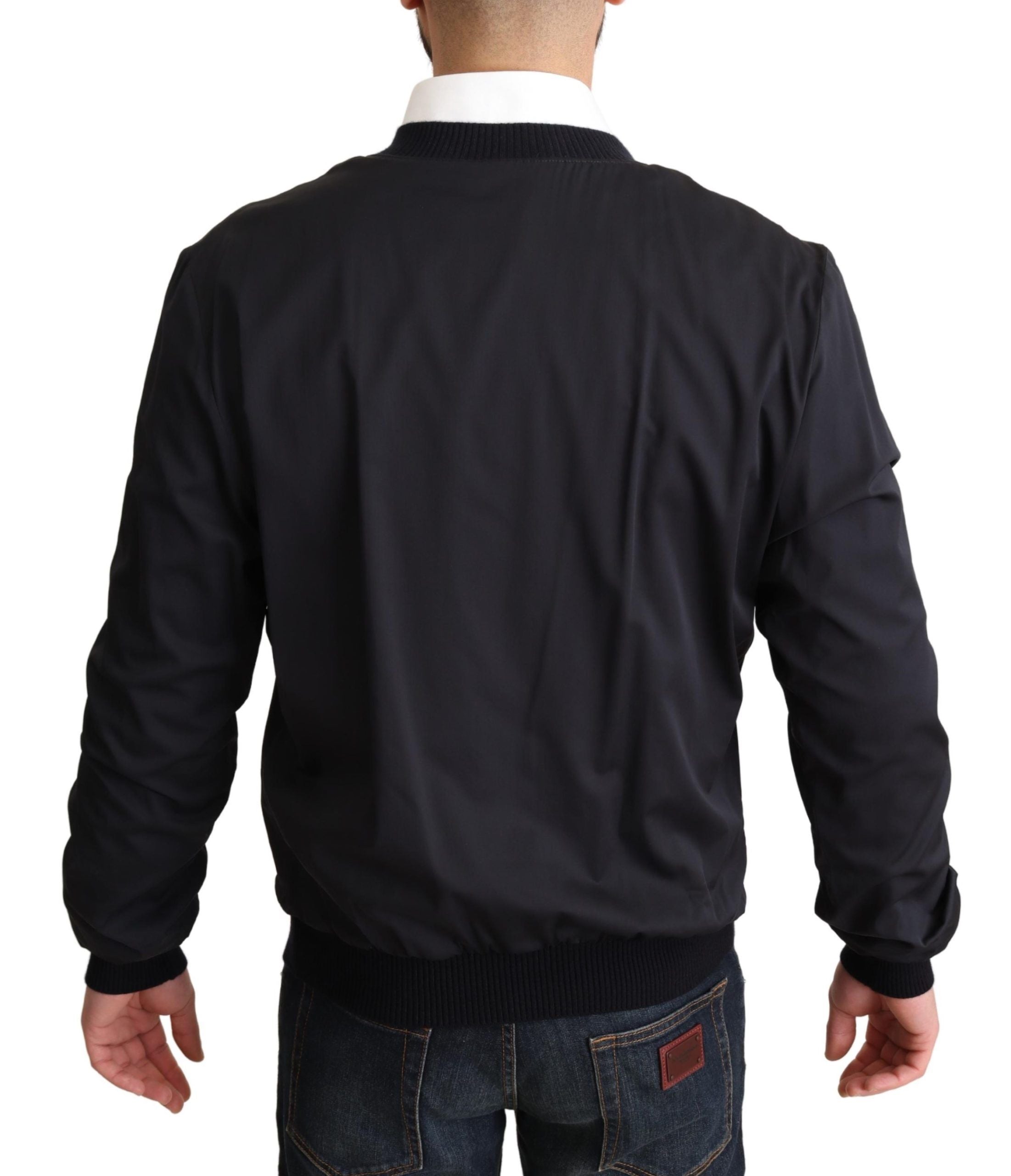 Blouson homme court Dolce & Gabbana en soie bleue, style bomber avec fermeture éclair et col ras du cou.