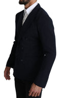 Manteau blazer bleu marine à pois Dolce & Gabbana, double boutonnage, coupe élégante et détails sophistiqués.