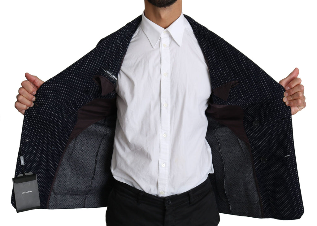 Manteau blazer bleu foncé à pois de Dolce & Gabbana, double boutonnage, coupe élégante, porté en image.