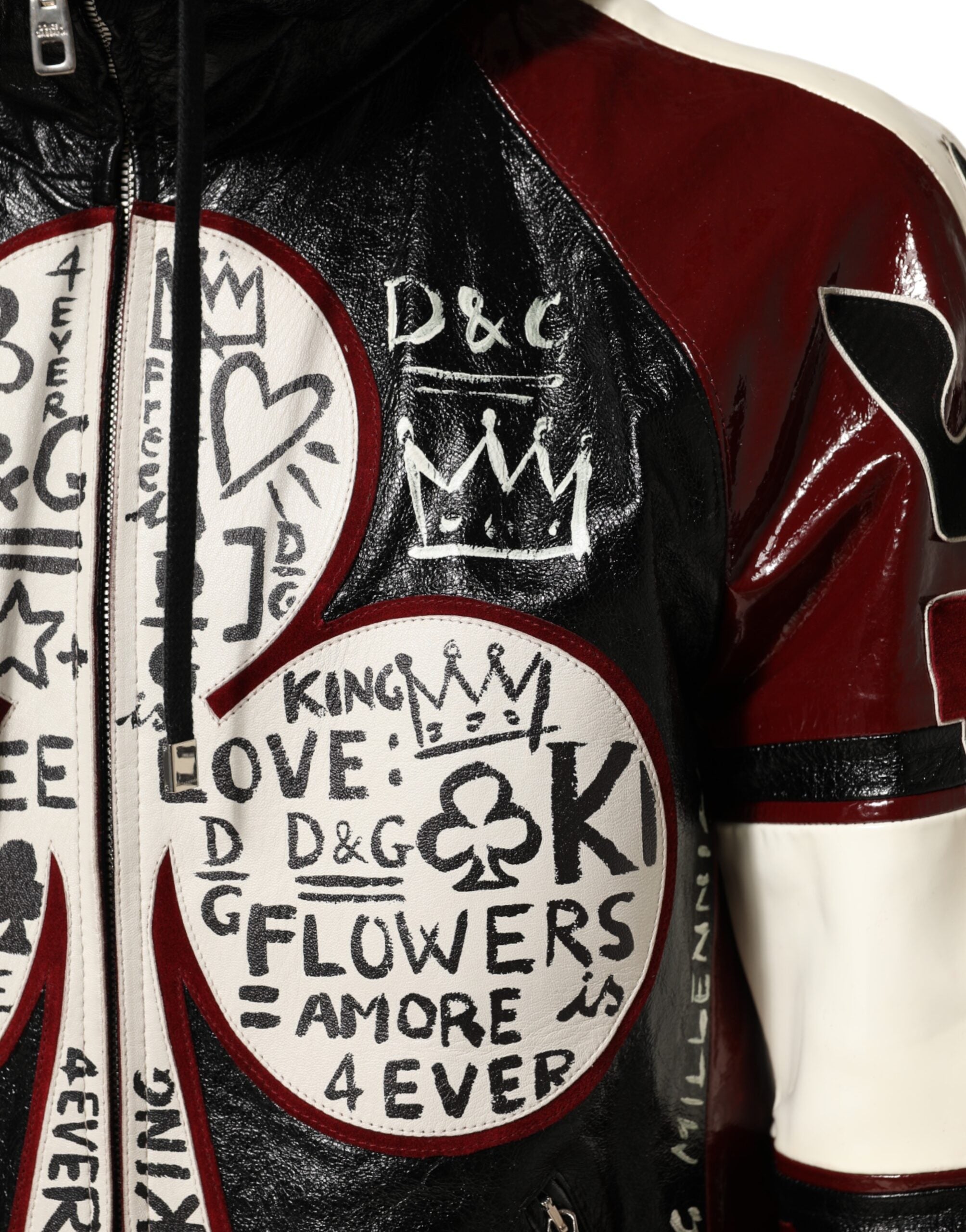 Veste en cuir multicolore à capuche Dolce & Gabbana DG King pour homme, style motard avec détails colorés.