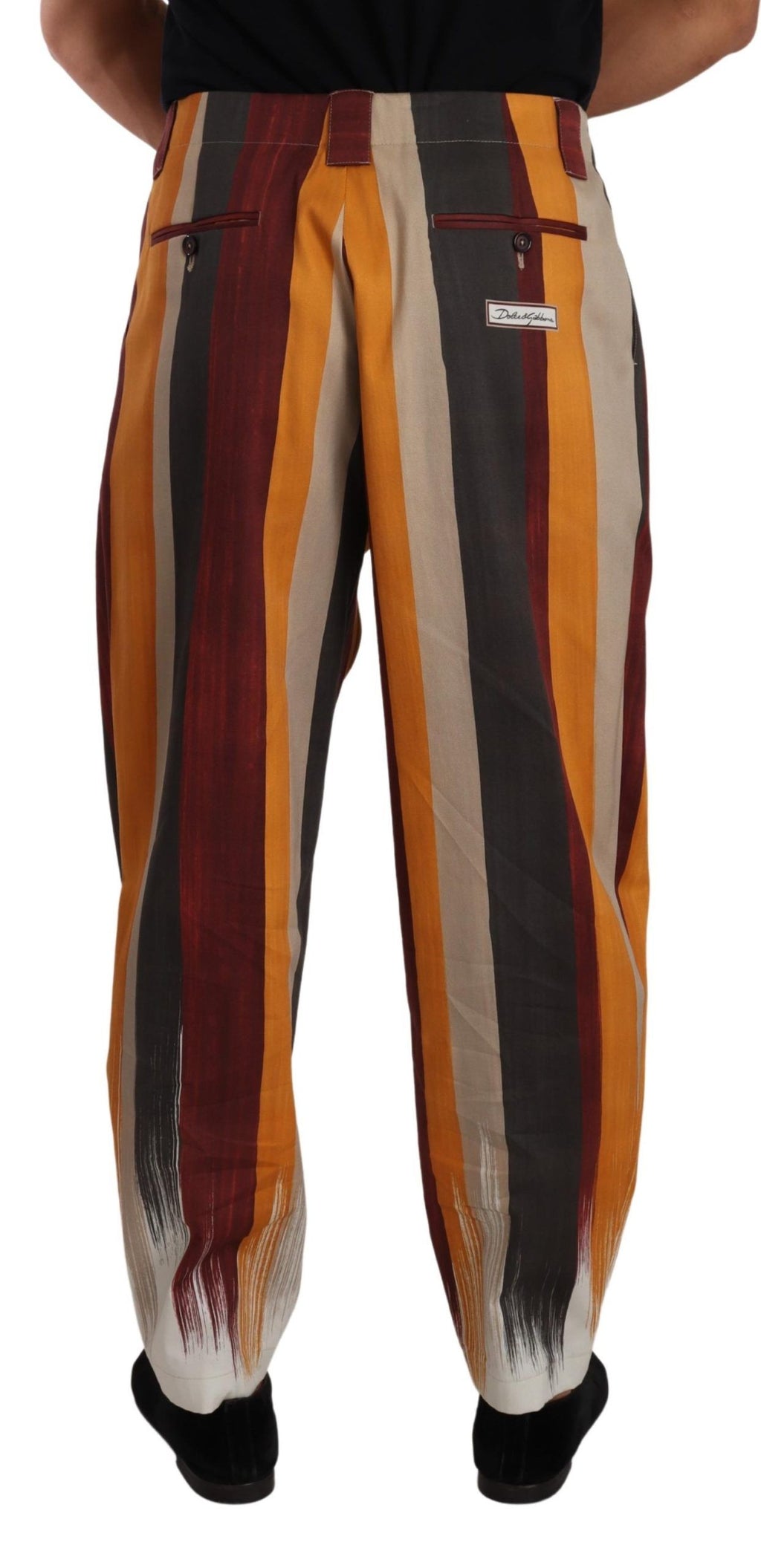 Pantalon Dolce & Gabbana en coton à rayures multicolores, coupe tapered, visible sur l'image.