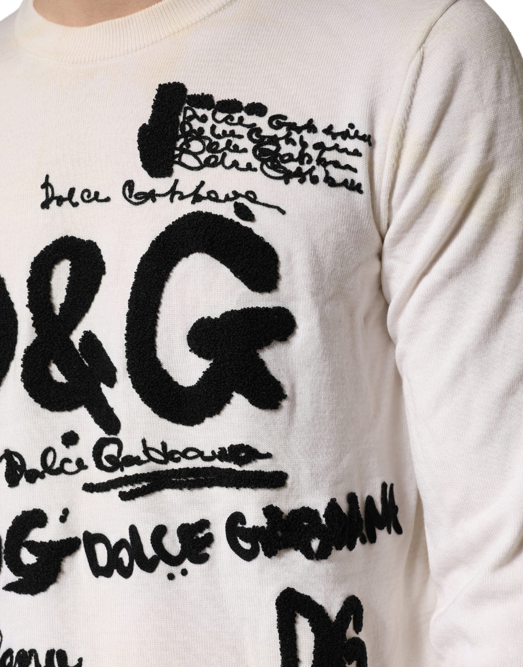 Pull en laine vierge blanche Dolce & Gabbana avec logo graphique, col rond et design élégant, vue de face.