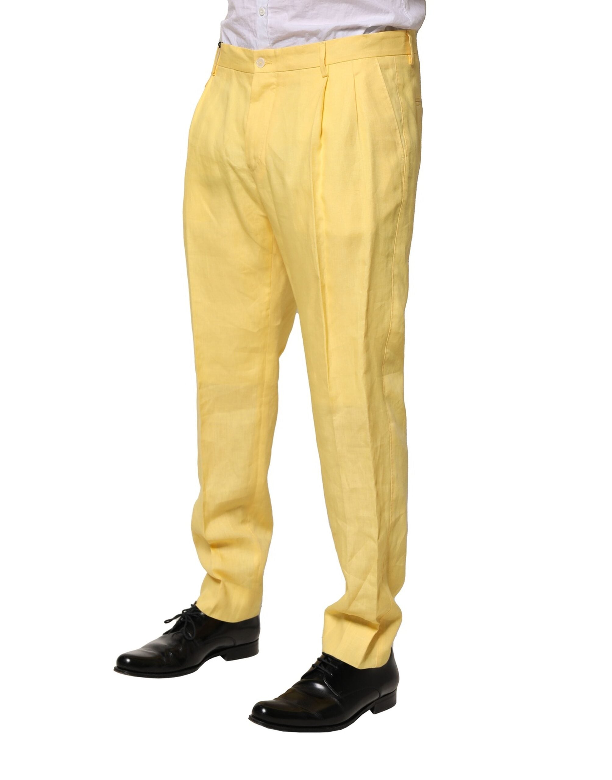 Pantalon homme Dolce & Gabbana jaune en lin tissé, coupe tapered, vue sur le devant avec détails de couture.