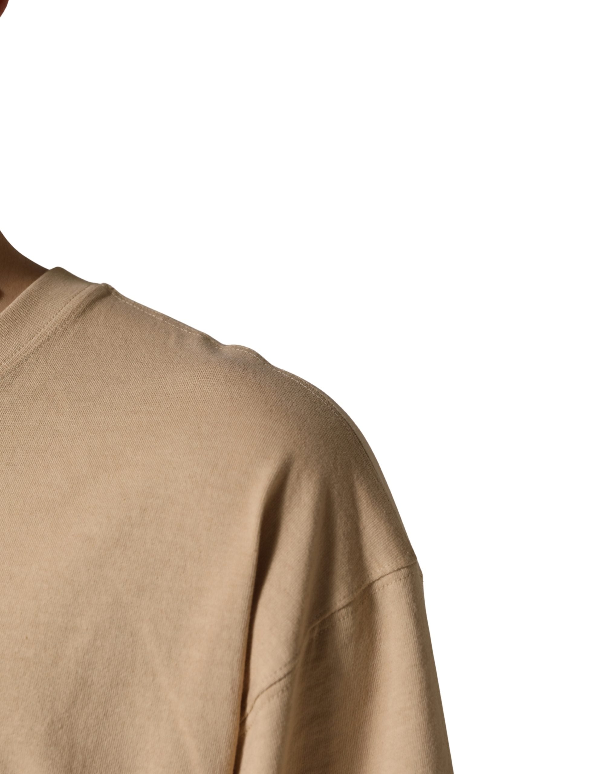 T-shirt beige en coton Dolce & Gabbana à col rond, coupe oversize, vue de face.