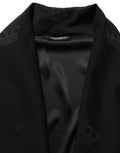 Robe homme Dolce & Gabbana en soie noire, coupe kimono, vêtement élégant avec ceinture, vue de face.