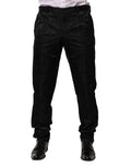 Pantalon de costume noir en coton Dolce & Gabbana avec logo en forme de couronne, élégant et moderne, visible en détail.