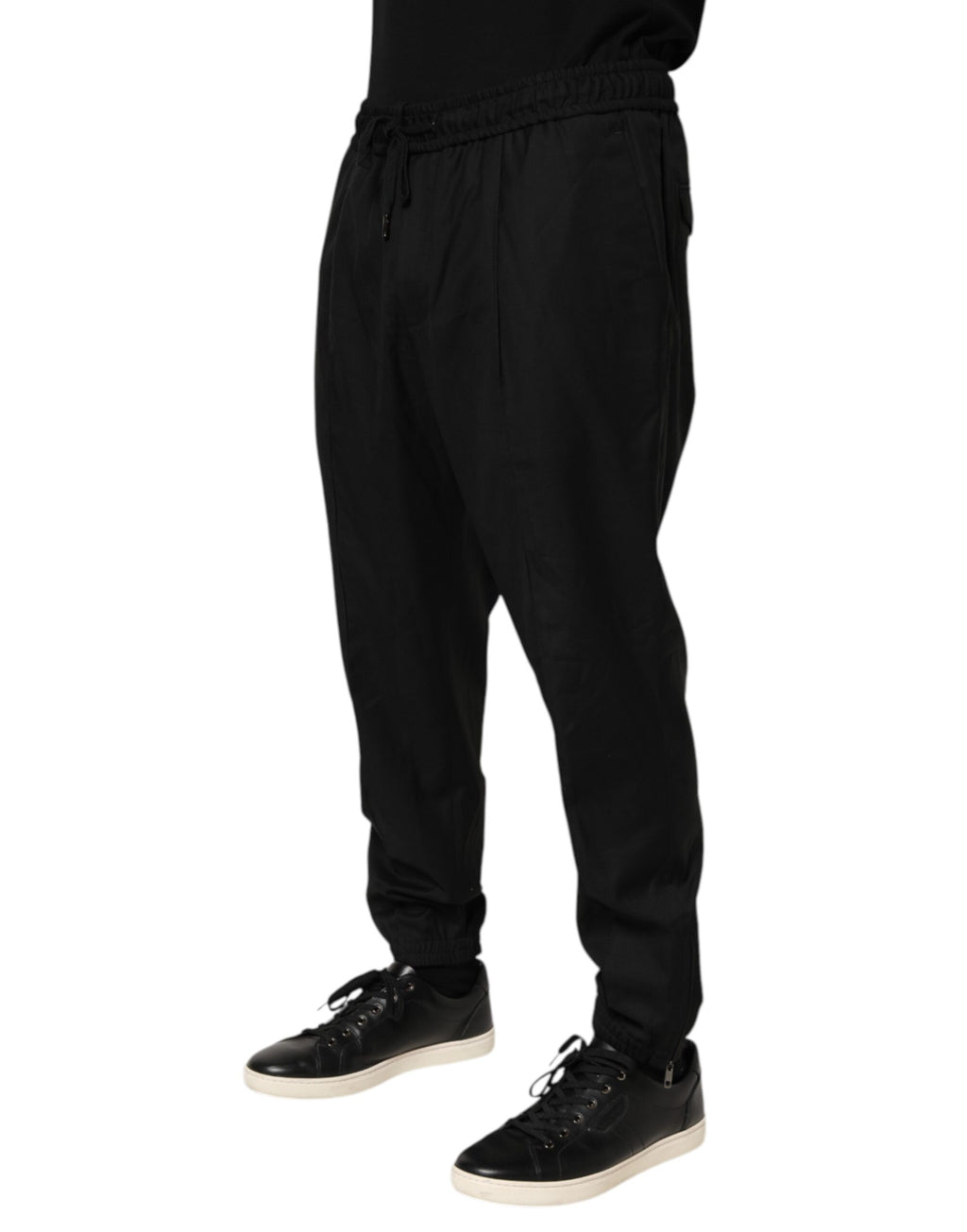 Pantalon de jogging noir pour homme Dolce & Gabbana avec cordon de serrage, look décontracté et style élégant.