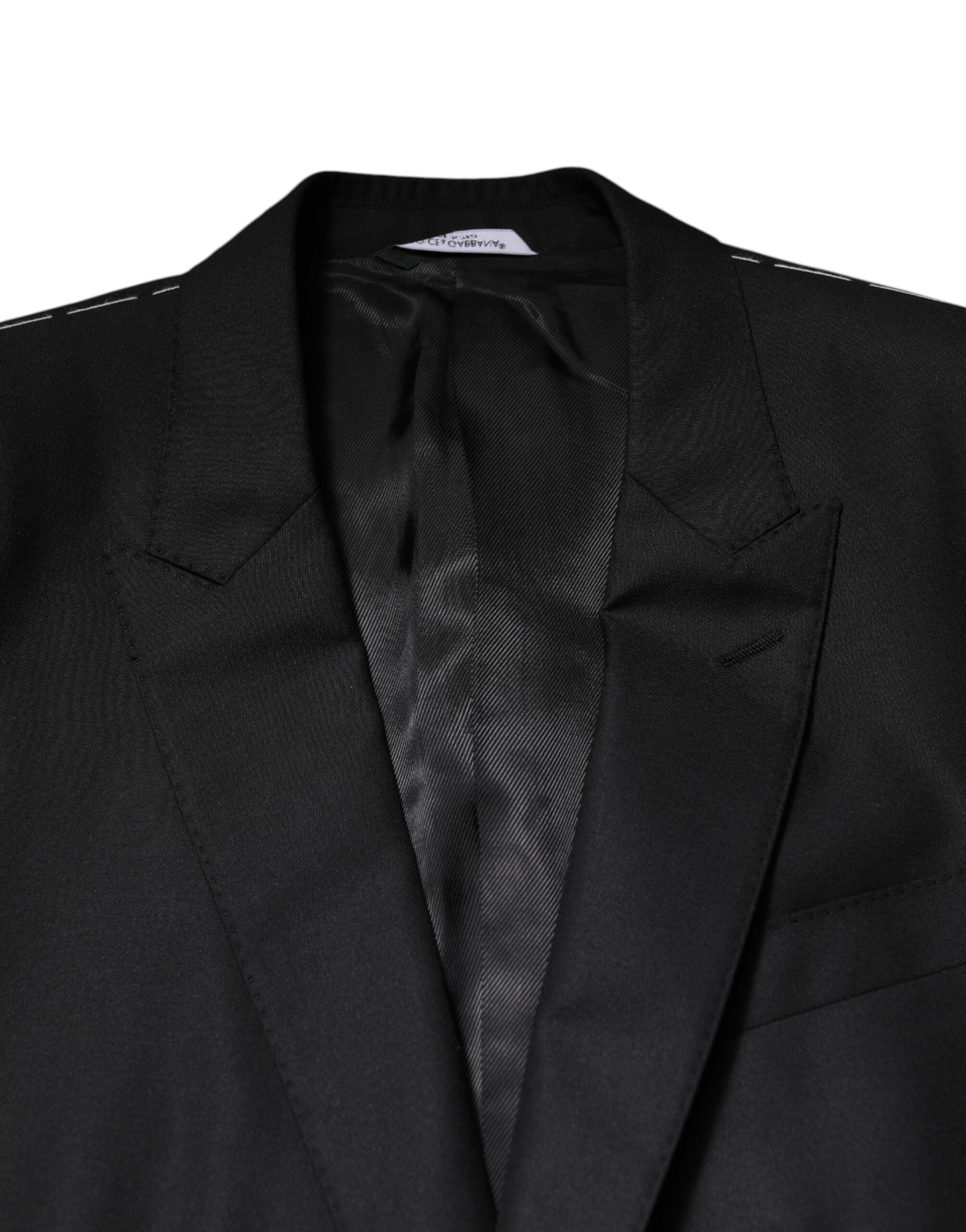 Costume noir Dolce & Gabbana à deux pièces avec veste croisée simple et détails élégants, vu de face.