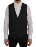 Gilet gris Dolce & Gabbana STAFF en coton et rayonne, porté sur un mannequin, détails du tissu et coupe élégante visibles.