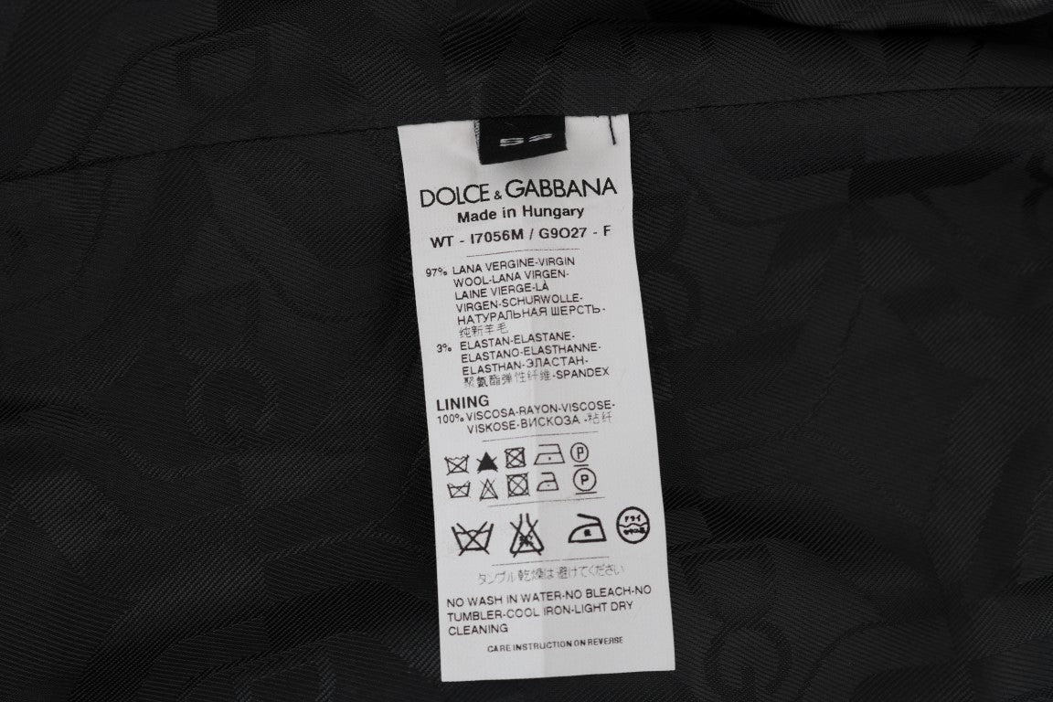 Gilet en laine gris Dolce & Gabbana pour homme, ajusté et élégant, visible avec détails de couture et col ras du cou.