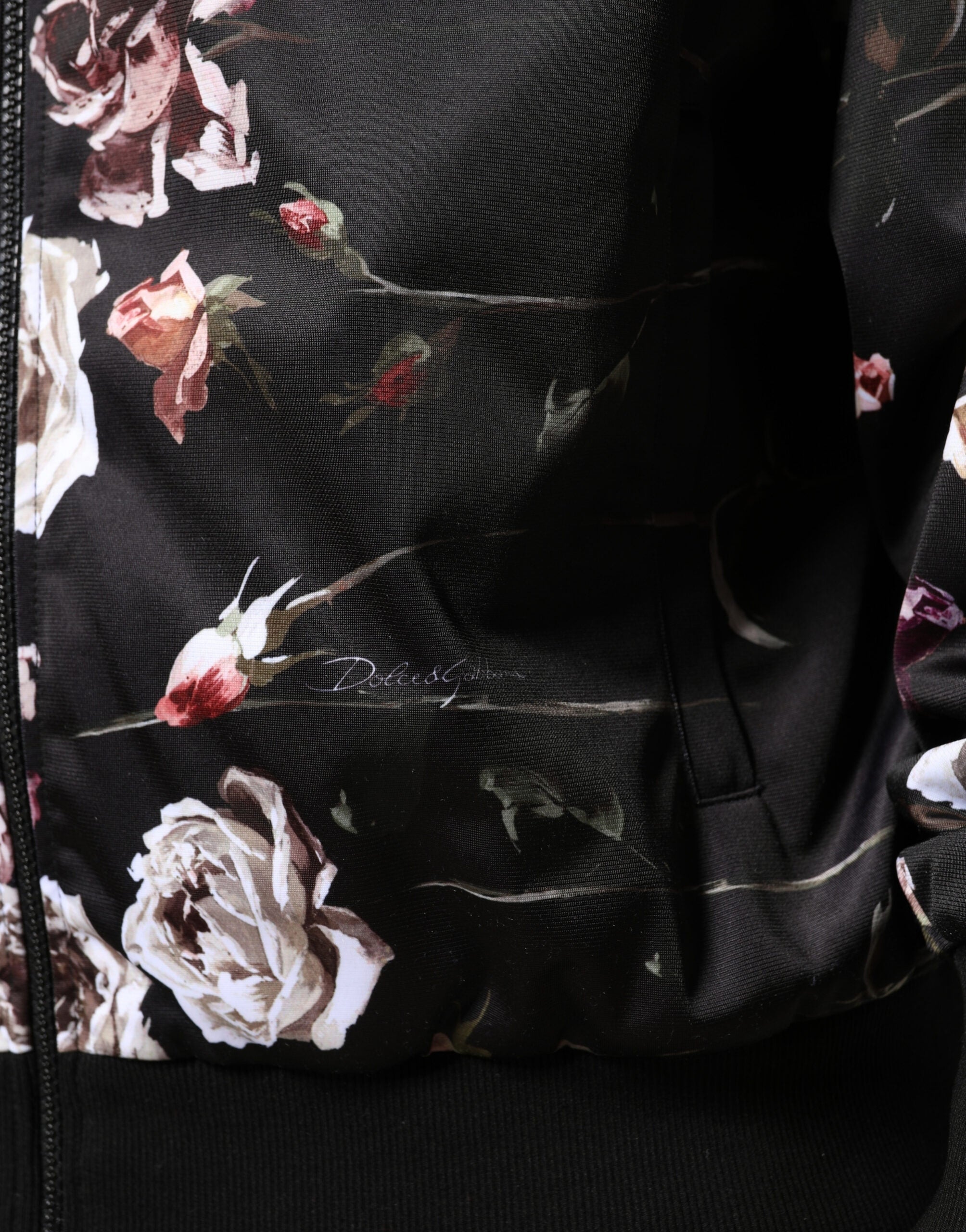Veste bomber noire en polyester avec motifs floraux Dolce & Gabbana, zip complet et style élégant.