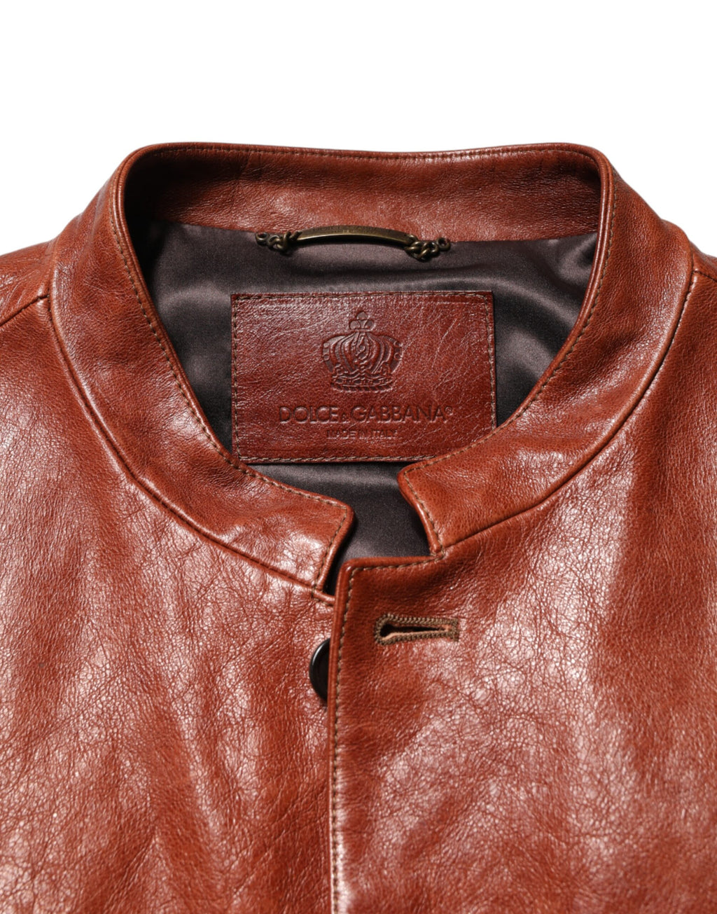 Veste en cuir marron pour homme de style motard avec boutons, Dolce & Gabbana, visible sur l'image.