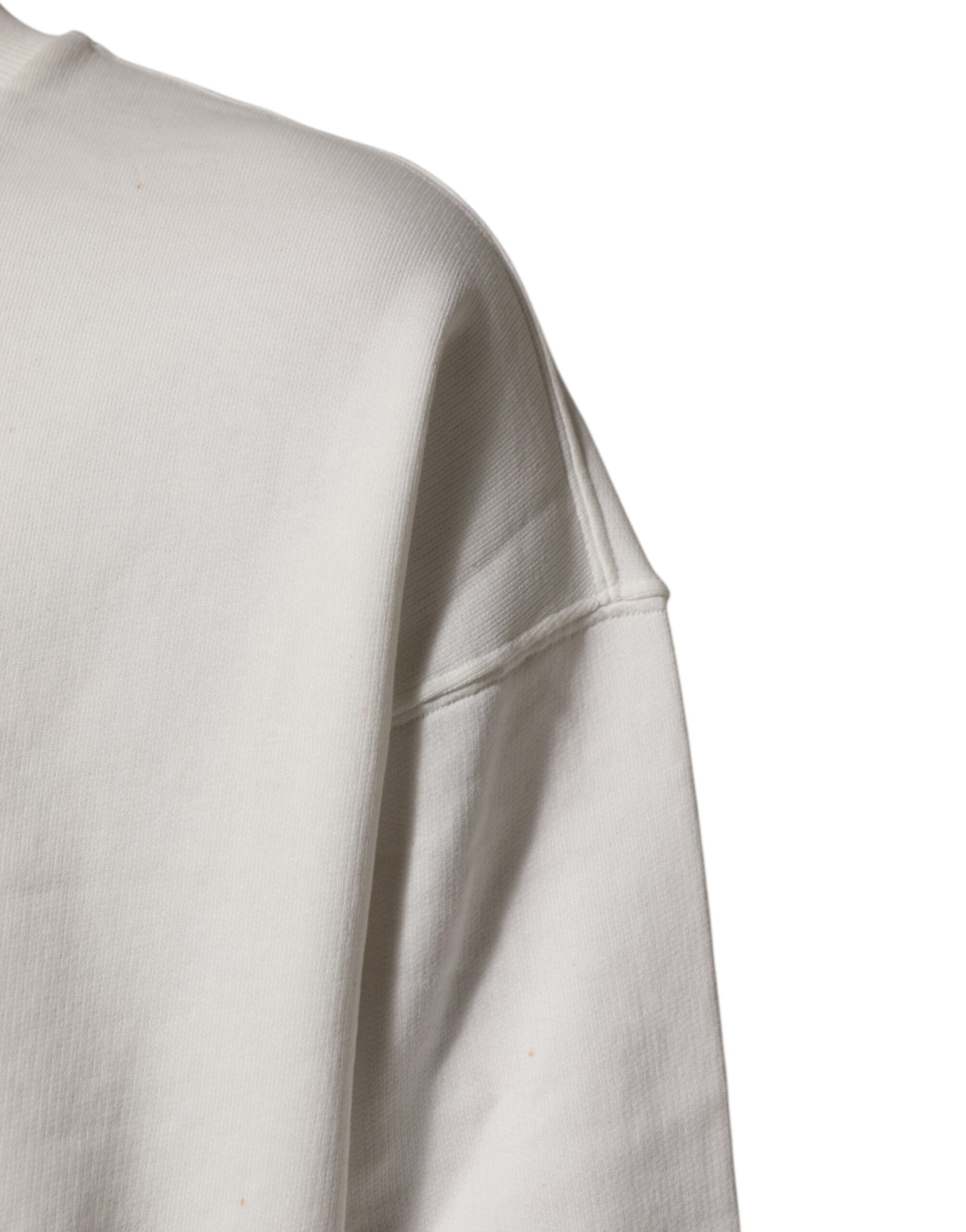 Sweat-shirt blanc Dolce & Gabbana avec logo DG, col ras du cou, en coton, porté sur un mannequin.
