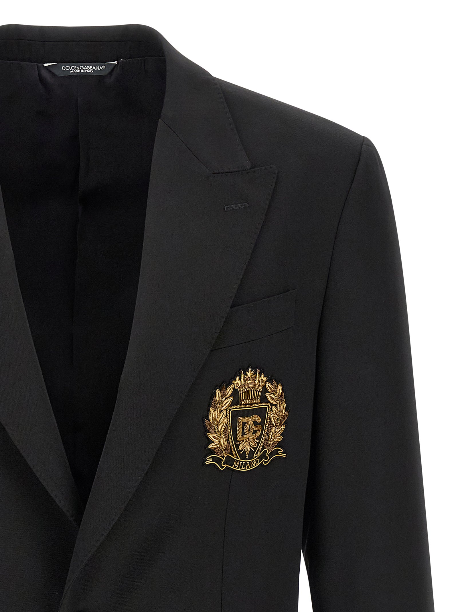 Veste blazer noire en laine vierge de Dolce & Gabbana, coupe élégante et sophistiquée, portée sur un mannequin.