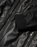 Veste blouson noire en cuir et nylon de Dolce & Gabbana, fermeture éclair complète, style élégant et moderne.