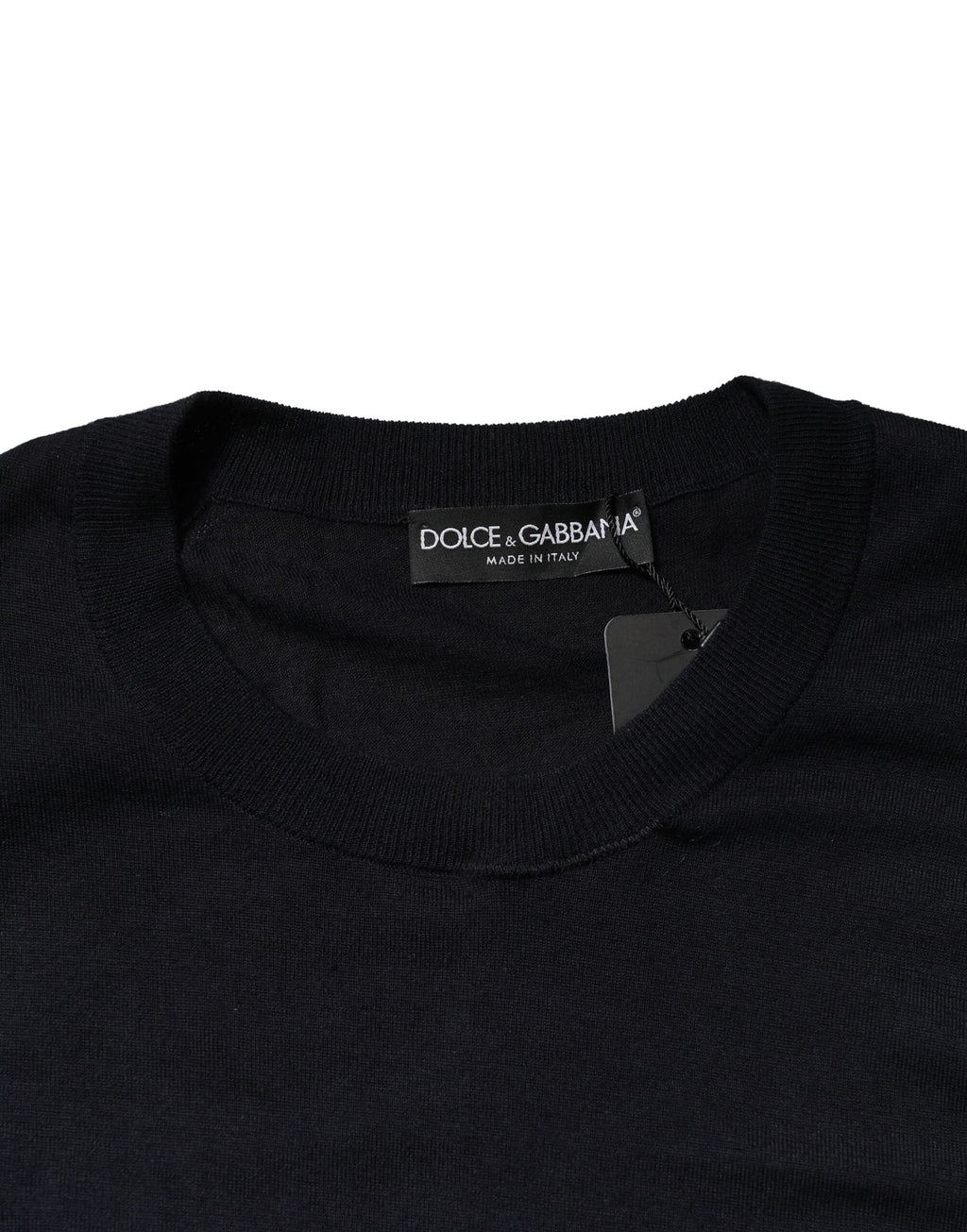 Pull-over noir à manches longues Dolce & Gabbana, col rond, en laine, porté en gros plan sur fond blanc.