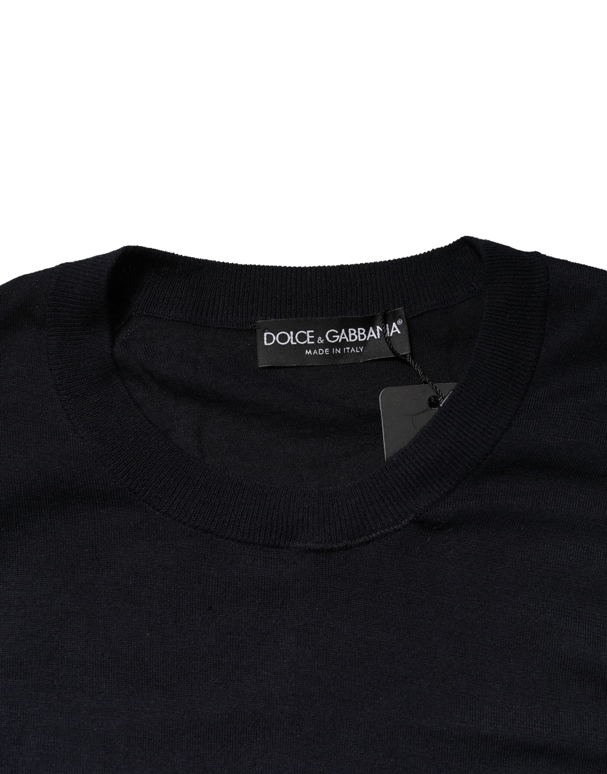 Pull-over noir à manches longues Dolce & Gabbana, col rond, en laine, porté en gros plan sur fond blanc.