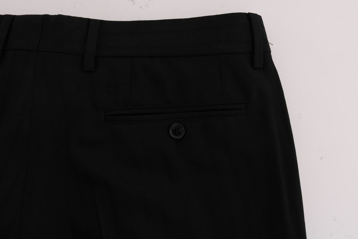 Pantalon en laine noire à rayures Dolce & Gabbana, coupe stretch, avec ceinture et détails élégants.