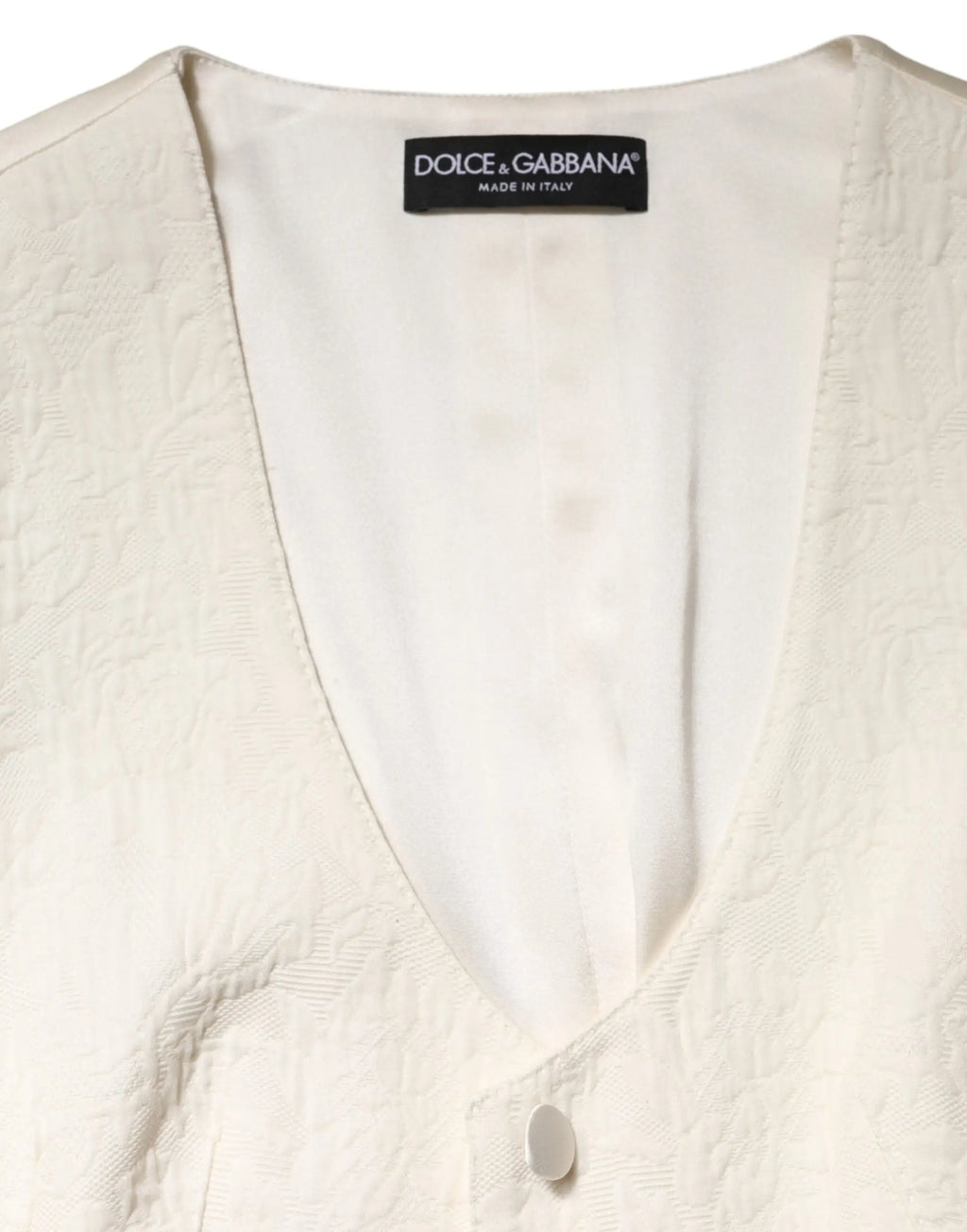 Gilet sans manches ivoire en coton texturé avec étiquette noire dolce et gabbana cousue à lencolure
